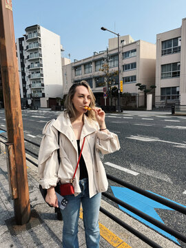 Trying dango street food in Osaka Japan