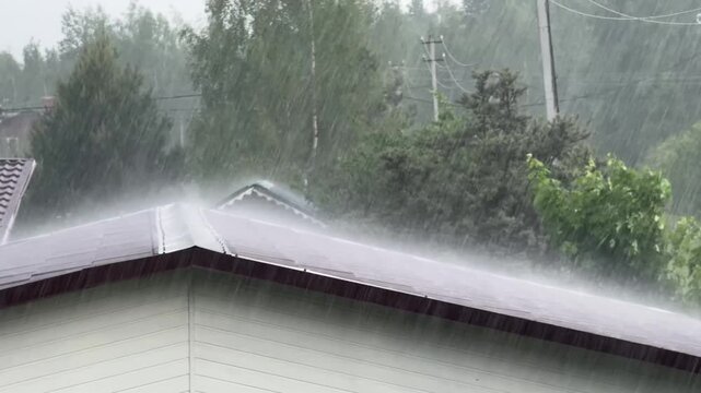 Heavy summer rain on the window