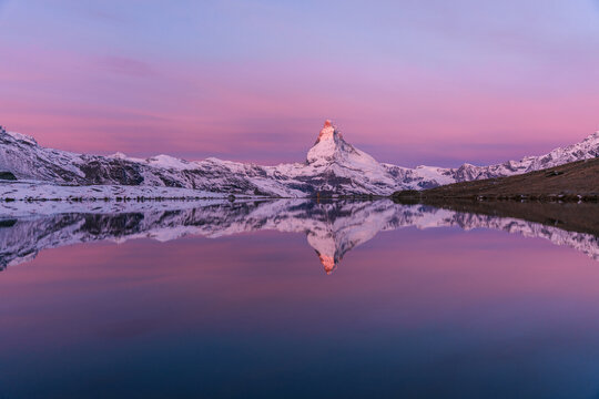 Wide reflection of the Matterhorn on an epic morning in fall