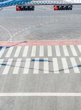 Red Traffic Lights Above Empty Urban Street Crosswalk