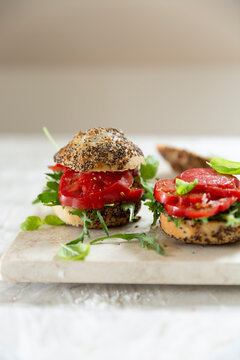 Tomato sandwich with arugula and basil