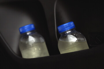 The water bottle in the car.