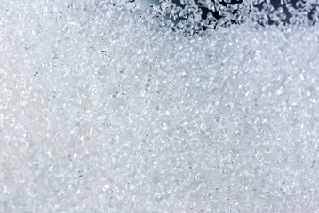 Obraz premium Close up of crystal sugar in a Glass Jar on black background.