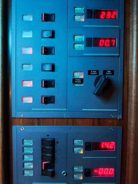 Electrical control panel with switches and digital displays
