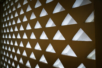 Angular triangle shaped window with light and shadow