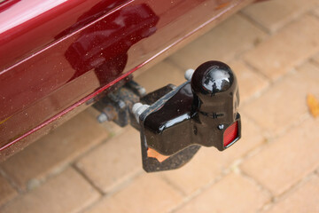 Covered tow bar with rear reflector on a classic vehicle