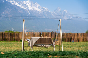 Hammock lounge chair in the yard with snow mountain view