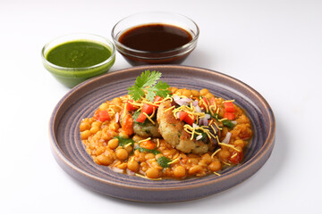 Ragda patice chaat or Indian street food made with potato tikki and white dried peas curry
