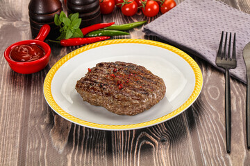 Grilled beef burger cutlet with sauce