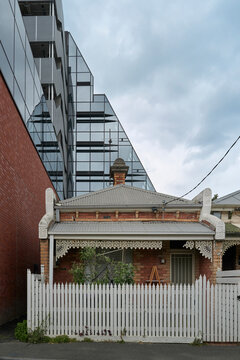 Victorian Brick House nestled against modern development