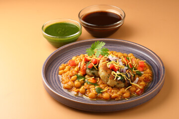 Ragda patice chaat or Indian street food made with potato tikki and white dried peas curry