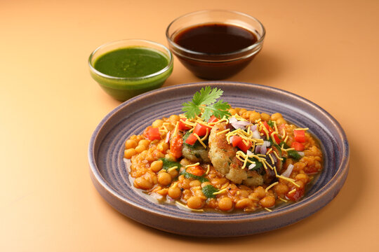 Ragda patice chaat or Indian street food made with potato tikki and white dried peas curry