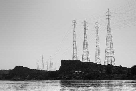 Fototapeta High Voltage Transmission Towers by the River