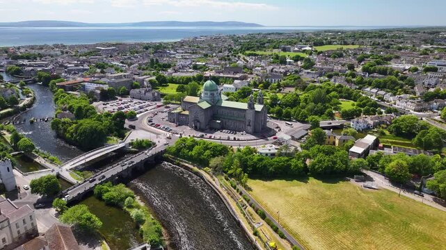 Bridge across river Corrib to Galway Cathedral, aerial panoramic. Ireland sunny day