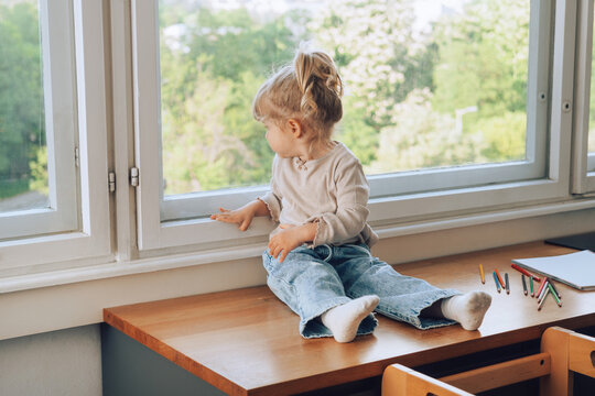 Toddler perched on countertop