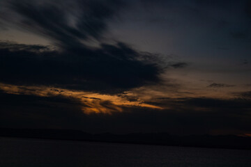 Dramatic Cloudscape at Sunset Over the Water