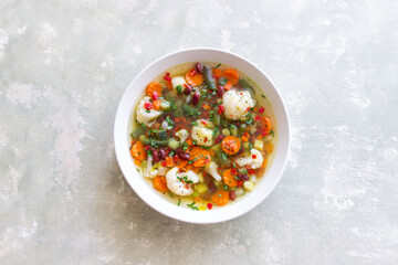 Vegetable soup with cauliflower, beans, carrots and zucchini. Healthy eating. Vegetarian food.