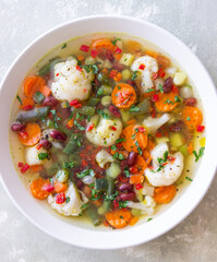 Vegetable soup with cauliflower, beans, carrots and zucchini. Healthy eating. Vegetarian food.