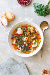 Vegetable soup with cauliflower, beans, carrots and zucchini. Healthy eating. Vegetarian food.