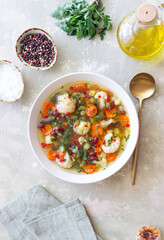 Vegetable soup with cauliflower, beans, carrots and zucchini. Healthy eating. Vegetarian food.