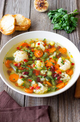 Vegetable soup with cauliflower, beans, carrots and zucchini. Healthy eating. Vegetarian food.