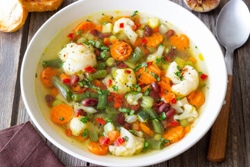 Vegetable soup with cauliflower, beans, carrots and zucchini. Healthy eating. Vegetarian food.
