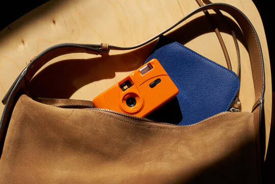 Film camera in a suede bag