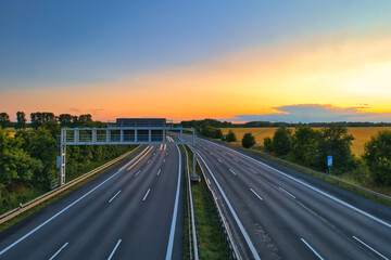 German Autobahn at Morning Speed ​​Traffic Light Trails  Motorway Long Exposure  Car  Sunset  Vacation	Trip Sunrise Highway Street Asphalt