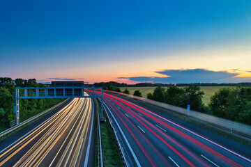 German Autobahn at Morning Speed ​​Traffic Light Trails  Motorway Long Exposure  Car  Sunset  Vacation	Trip Sunrise Highway Street Asphalt