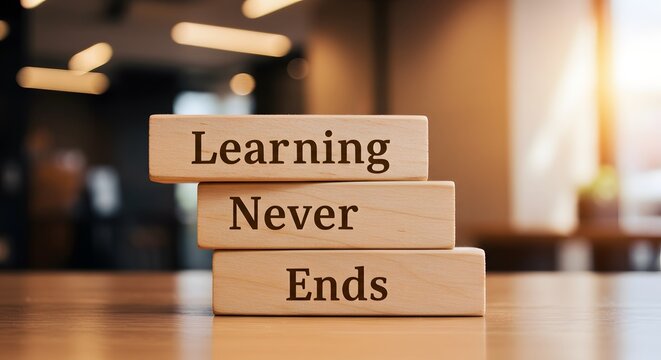 Wooden blocks spelling out 'Learning Never Ends', symbolizing lifelong education and growth

