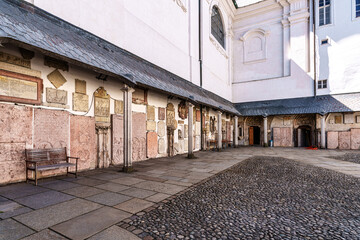 St. Stephans cathedral in Passau, Germany is an old white church with green metal domes on top of the towers