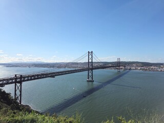 Fototapeta premium Ponte 25 de Abril bridge in Lisbon, Portugal seen from the south side of river Tajo