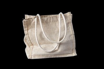 White textile shoping bag on black background