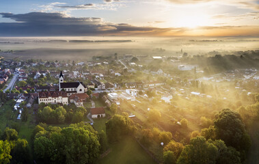 Lovely rural countryside in beautiful sunlight at sunrise with fog. Amazing landscape