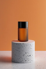 Amber Glass Bottle on Terrazzo Pedestal Against Orange Background