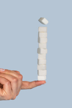 Sugar cubes isolated, abstract sugar addiction concept