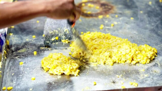 Jagung keju tarik (pulled cheese corn). Steam corn mixed with cheese. Indonesian modern street food.