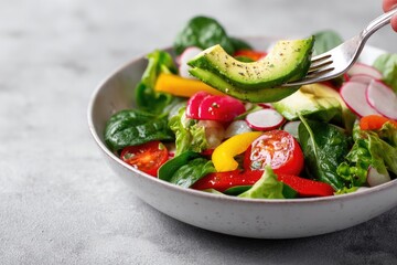 Forkful of vibrant vegetable salad