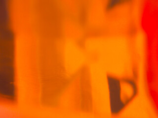 Orange light from blurred glass for abstract background