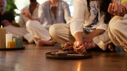 Lighting insence stick at wellness center