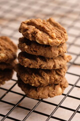 sesame, oat, peanut cookies with spice flavor on cooling rack. healthy food.