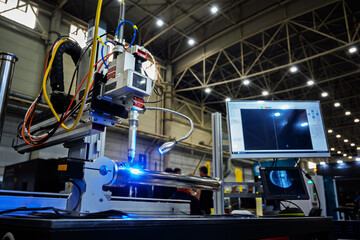 Industrial Welding Robot with Modern Technology and Digital Interface in a Brightly Lit Factory