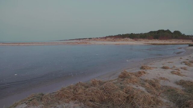Serene winter view from the breakwater at the Jamno Canal mouth in Łazy. 