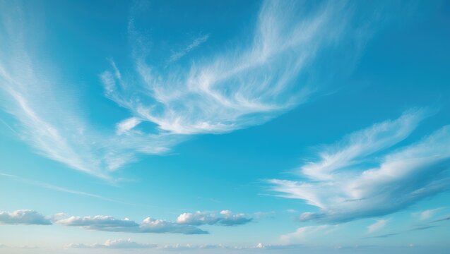 Ethereal cirrocumulus clouds drifting across a vibrant daytime sky