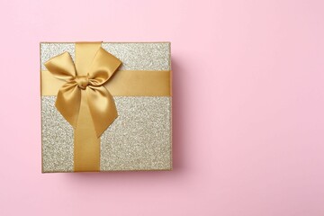 Beautiful gift box on color background, top view