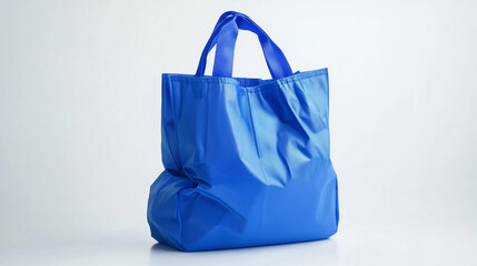 An isolated blue paper shopping bag with handles, perfect for retail, gifts, or purchases