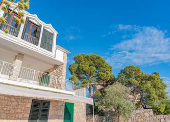 A coastal residential building in Primosten, Croatia, overlooks the vibrant blue Adriatic Sea