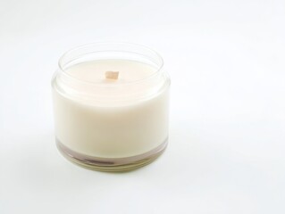 White wax candle in a transparent glass jar
