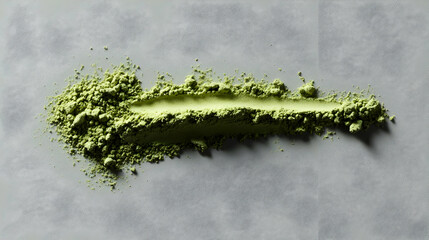 Fototapeta premium Streaked Matcha Green Powder On Gray Concrete Surface