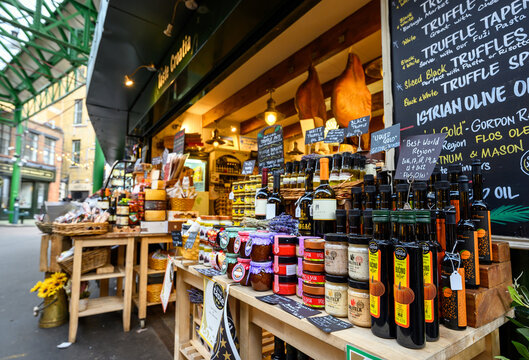 London, UK - Mar 22 2023: A stall in Borough Market. This famous and historical food market has been trading at this location since 1756. Foreground focus with shallow depth of field.